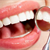 Help! Gum tissue is growing on the surface of my tooth. What should I do?